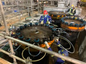 Bolt Tensioning on a flange with technicians